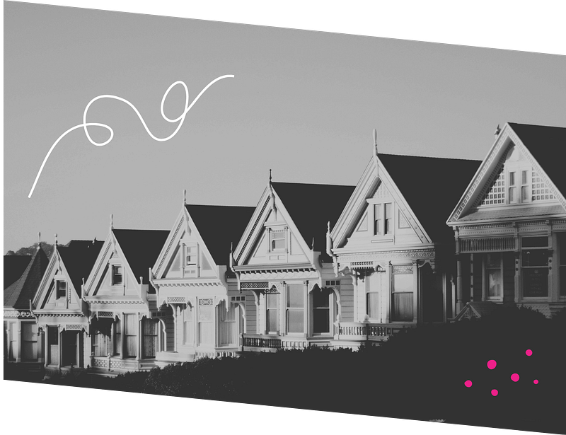 Row of Victorian-style houses with gabled roofs in grayscale, with a decorative white swirl and pink dots overlaid in the sky.